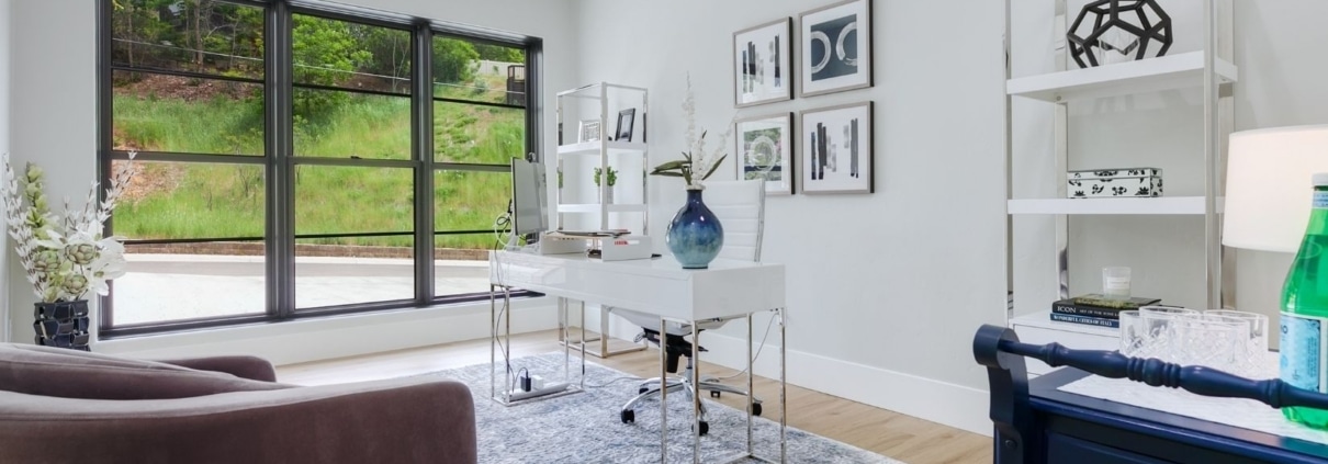 A stylish home office design in Boise featuring a desk, chair, and shelves, designed for productivity and comfort.