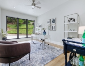 A stylish home office design in Boise featuring a desk, chair, and shelves, designed for productivity and comfort.