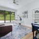 A stylish home office design in Boise featuring a desk, chair, and shelves, designed for productivity and comfort.